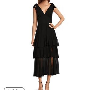 Wayf black tiered midi dress with slit and bows on shoulders